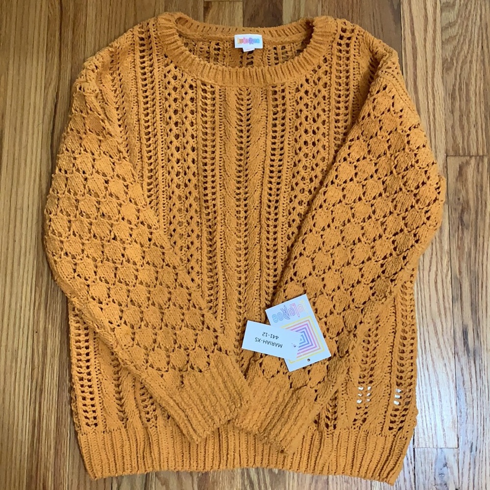 Very soft mustard colored NWT LuLaRoe Mariah sweater. XS.